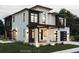 Stunning modern two-story home with white brick, dark accents, and inviting covered front porch at 3530 Fenton St, Wheat Ridge, CO 80212
