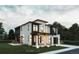 Striking two-story modern home with white brick, black trim, and a welcoming covered entrance at 3530 Fenton St, Wheat Ridge, CO 80212