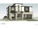 Modern two-story home with brick and siding exterior, large windows, and an attached garage at 3530 Fenton St, Wheat Ridge, CO 80212