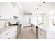 Contemporary kitchen with white cabinetry, stainless steel appliances, and a spacious layout at 3530 Fenton St, Wheat Ridge, CO 80212