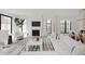 Bright, open living room with a fireplace, large windows, and modern decor at 3530 Fenton St, Wheat Ridge, CO 80212