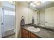 Bathroom featuring a vanity with a sink and a view of the shower and tub at 1771 W 53Rd Pl # 2, Denver, CO 80221