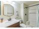 Modern bathroom featuring new fixtures, including a sink, toilet, and shower stall at 1771 W 53Rd Pl # 2, Denver, CO 80221
