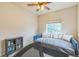 Bedroom with daybed, a ceiling fan, and a full bookcase for storage at 1771 W 53Rd Pl # 2, Denver, CO 80221