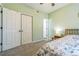 Spacious carpeted bedroom features two closets and an entrance to another room at 1771 W 53Rd Pl # 2, Denver, CO 80221