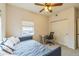 Bedroom with a daybed, ceiling fan, and a built in desk next to the closet at 1771 W 53Rd Pl # 2, Denver, CO 80221