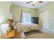 Comfortable bedroom with ample natural light, ceiling fan, and view of the closet at 1771 W 53Rd Pl # 2, Denver, CO 80221