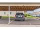 Carport provides covered parking, protecting vehicles from the elements in a convenient setting at 1771 W 53Rd Pl # 2, Denver, CO 80221