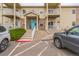 Charming condo complex with well-maintained landscaping, parking, and attractive architecture at 1771 W 53Rd Pl # 2, Denver, CO 80221