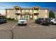 Attractive condo exterior showcasing a well-maintained facade, ample parking, and inviting curb appeal at 1771 W 53Rd Pl # 2, Denver, CO 80221