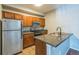 Efficient kitchen with stainless steel appliances and ample cabinet space at 1771 W 53Rd Pl # 2, Denver, CO 80221