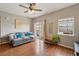 Cozy living room with hardwood floors, slider door, and comfortable gray sofa at 1771 W 53Rd Pl # 2, Denver, CO 80221