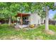 Enjoy the covered back deck and patio, perfect for grilling and chilling under the shade trees at 17692 E Brunswick Pl, Aurora, CO 80013