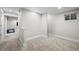 This is a room in a basement with carpet and white walls at 17692 E Brunswick Pl, Aurora, CO 80013