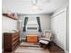 This is a small bedroom or Bedroom with chair, dresser, shelf, and closet at 17692 E Brunswick Pl, Aurora, CO 80013