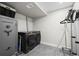 This laundry room features a modern washer and dryer, with a security safe and a clothes steamer at 17692 E Brunswick Pl, Aurora, CO 80013