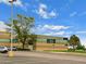 Columbia Middle School featuring parking, a green lawn and mature trees around the exterior at 17692 E Brunswick Pl, Aurora, CO 80013
