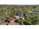 An aerial view of a home with a lush backyard, patio, and detached garage in a well-manicured neighborhood at 949 Pontiac St, Denver, CO 80220