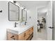Modern bathroom featuring a double vanity with quartz countertops, sleek fixtures, and stylish decor at 949 Pontiac St, Denver, CO 80220