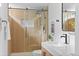 Bright bathroom with a modern vanity, glass shower, and stylish fixtures at 949 Pontiac St, Denver, CO 80220
