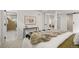 Bedroom view showcases a comfortable bed, a desk area, and a glimpse into the modern bathroom, enhancing its appeal at 949 Pontiac St, Denver, CO 80220