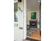 Inviting entryway featuring a fireplace, hardwood floors, and contemporary decor elements at 949 Pontiac St, Denver, CO 80220