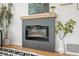 A modern fireplace anchors the room with a neutral decor and mantel at 949 Pontiac St, Denver, CO 80220