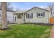 A well-maintained home with neat landscaping, and large lawn at 949 Pontiac St, Denver, CO 80220
