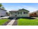 Charming single-story home with neat landscaping, inviting curb appeal, and well-maintained exterior at 949 Pontiac St, Denver, CO 80220