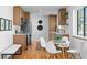 Updated kitchen boasts wood floors, stainless appliances, and white quartz countertops at 949 Pontiac St, Denver, CO 80220