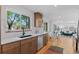 Updated kitchen boasts wood floors, stainless appliances, and white quartz countertops at 949 Pontiac St, Denver, CO 80220