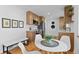 Bright kitchen features quartz countertops, stainless appliances, and eat-in breakfast area at 949 Pontiac St, Denver, CO 80220