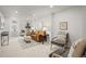 Stylish living room with neutral carpet, an orange couch, and thoughtfully chosen decor for a cozy aesthetic at 949 Pontiac St, Denver, CO 80220