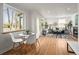 This home has an open layout with a combined living and dining area, filled with natural light at 949 Pontiac St, Denver, CO 80220
