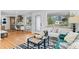 Open-concept living room blending seamlessly with the kitchen and dining area, creating an inviting space at 949 Pontiac St, Denver, CO 80220
