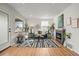Bright living room featuring hardwood floors, fireplace and large windows at 949 Pontiac St, Denver, CO 80220