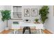Cozy home office with white desk, modern chair, wood floors, and ample natural light at 949 Pontiac St, Denver, CO 80220