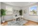 Office space featuring hardwood floors, natural light, white trim, and botanical art at 949 Pontiac St, Denver, CO 80220