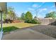 The well-maintained backyard features a wooden fence and mature landscaping at 7310 Granada Rd, Denver, CO 80221