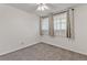 Bedroom with two windows and sheer curtains at 7310 Granada Rd, Denver, CO 80221