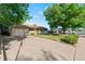 Lovely ranch-style home featuring a long driveway and well-kept lawn in a quiet neighborhood with mature trees at 7310 Granada Rd, Denver, CO 80221