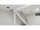 Staircase in finished basement with black iron railing at 12927 W 20Th Ave, Golden, CO 80401