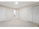 Bedroom features new carpet, closet, and a view to an ensuite bathroom at 12927 W 20Th Ave, Golden, CO 80401