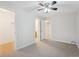 Spacious bedroom featuring ceiling fan, closets, carpet, and ensuite access at 12927 W 20Th Ave, Golden, CO 80401