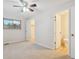 Bright bedroom with ceiling fan and two closets at 12927 W 20Th Ave, Golden, CO 80401