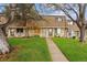 Charming townhouse with a well-maintained lawn and inviting walkway at 12927 W 20Th Ave, Golden, CO 80401