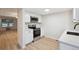 Modern kitchen featuring stainless steel appliances, white cabinets and light flooring at 12927 W 20Th Ave, Golden, CO 80401