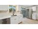 Beautiful kitchen with white cabinets, stainless steel appliances, and bright natural light at 12927 W 20Th Ave, Golden, CO 80401