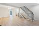 Bright and spacious living room with staircase and views into the dining room and bathroom at 12927 W 20Th Ave, Golden, CO 80401