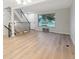 Inviting living area with staircase, large window, and wood-look flooring at 12927 W 20Th Ave, Golden, CO 80401